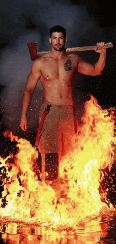 Fireman Holding Axe in Front of Flames