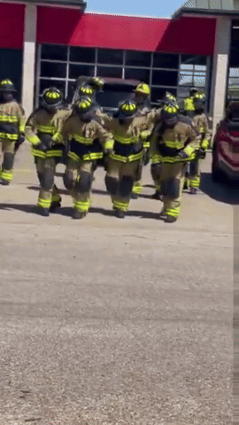 Fireman In Helmet And Goggles With Letter G GIF