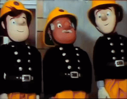 Fireman In Yellow Helmet 510 Spraying Water GIF