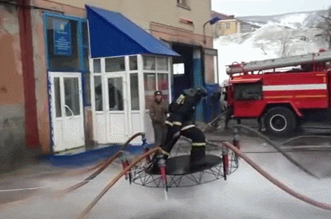 Fireman Levitate Using Fire Hose GIF