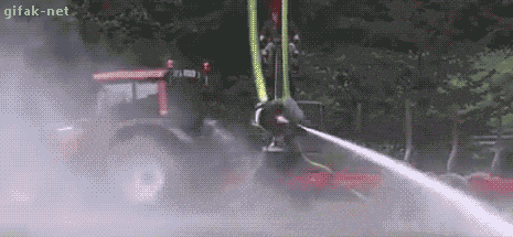 Fireman Swing Around Using Fire Hose GIF