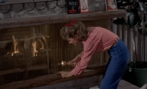Fireplace And Lady With Trophy GIF