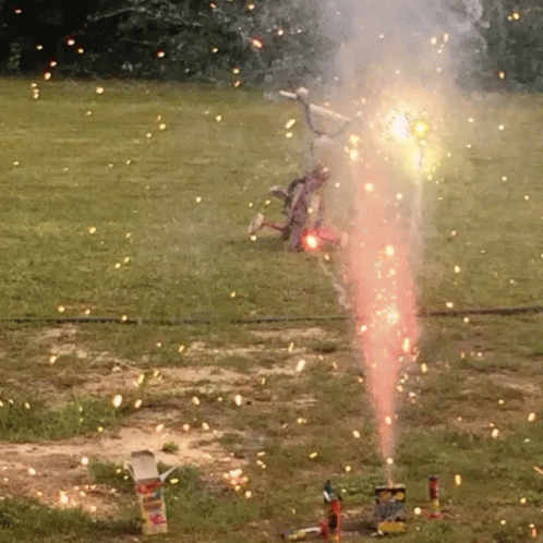 Fireworks Display in Field With Box in Foreground