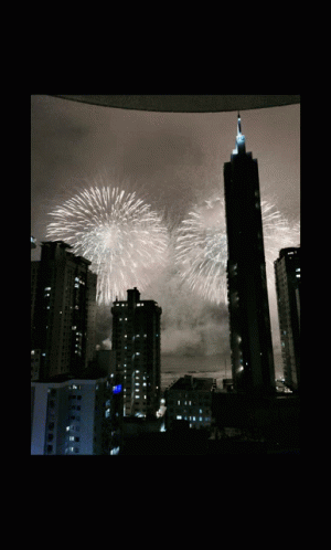 Fireworks Over City Skyline GIF