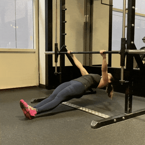 Fit Lady Uses Barbell Row In The Gym GIF
