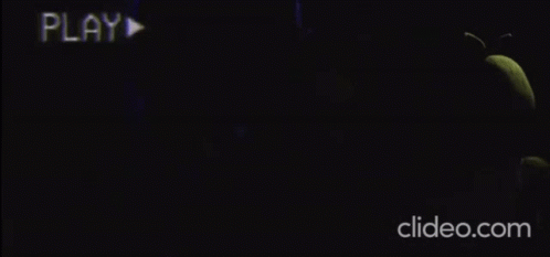five nights at freddy 's is a video game that is being played in a dark room .