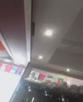 Flags Hanging Above Coffee Machine