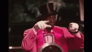 Flavor Flav Wearing A Pink Suit GIF