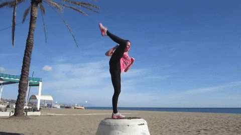 Flexible Woman Does One Leg Standing While Kicking GIF
