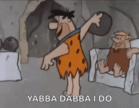 Flintstone Holding Rock Next to Chair