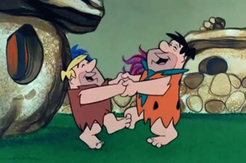 Flintstones Dancing in Front of Stone House