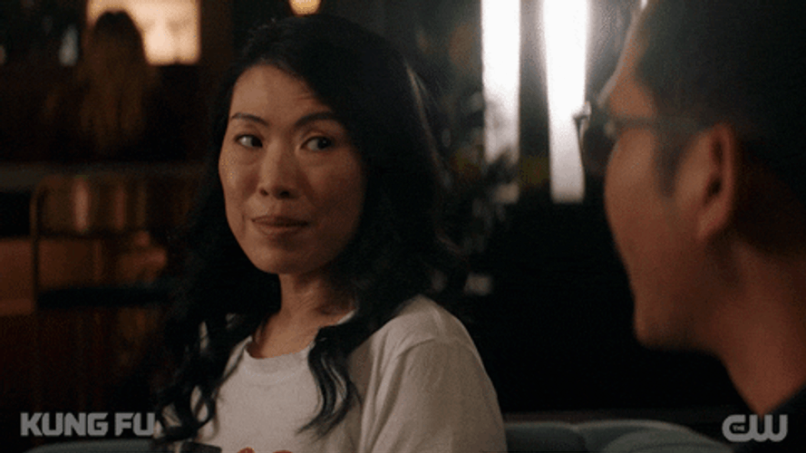 Flirting Woman Grin Face Kung Fu GIF