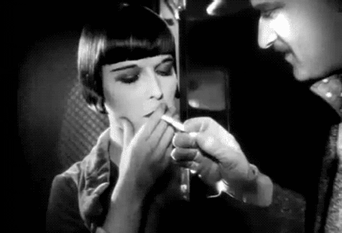 Flirty Marlene Dietrich Smoking Out GIF