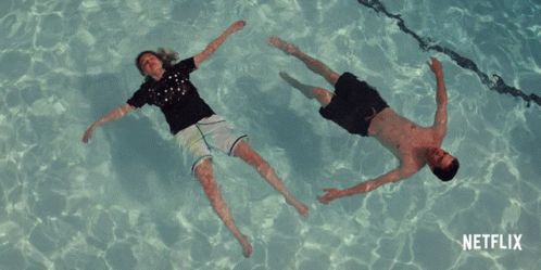 Colin Ford Floating In Pool GIF