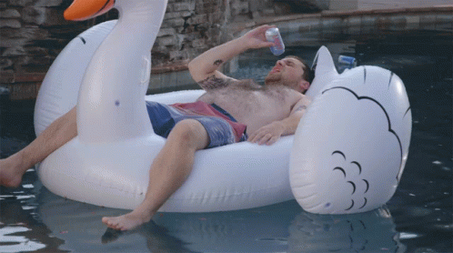 Relaxing Man Floating In Pool GIF