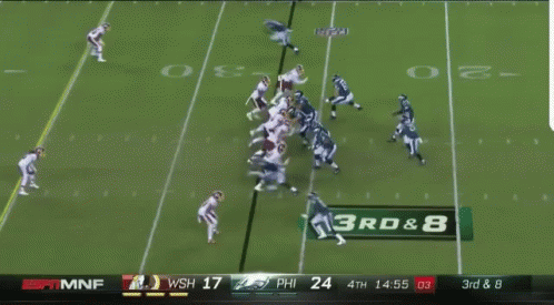 Football Game at 3rd and 8 Yard Line