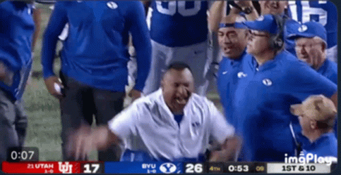 Football Game Between Utah and BYU on Screen