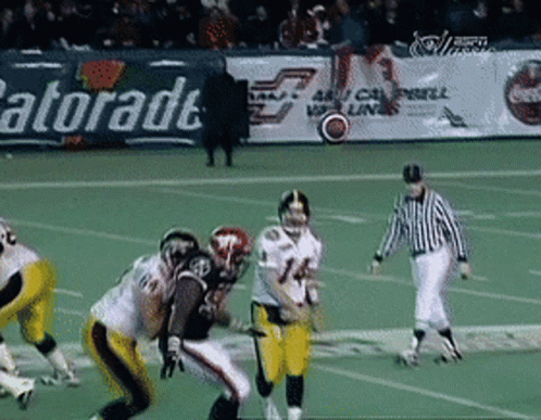 Football Game In Front Of Gatorade Banner GIF