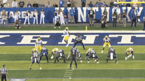 Football Game In Front Of Kentucky Sign GIF