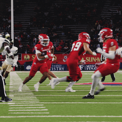 Football Game in Front of Sun-M Advertisement