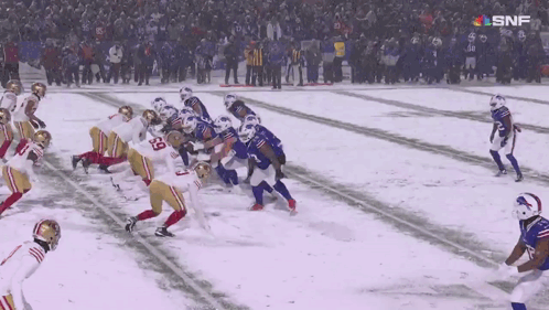 Football Game In Snow With SNF Logo GIF