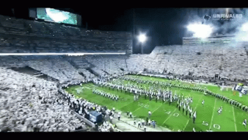 Football Game in Stadium With Unrivaled Banner