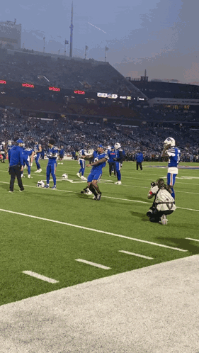 Football Game In Stadium With Verizon Sign GIF