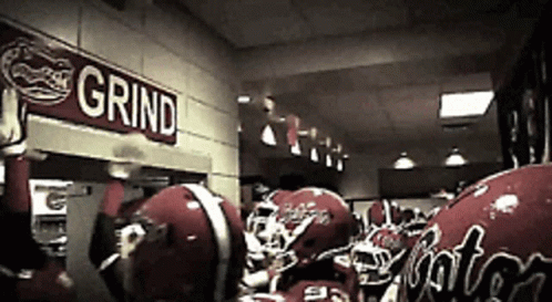 Football Helmets Lined Up Under Grind Sign