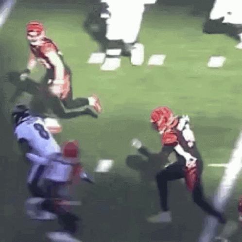 Football Player Being Tackled
