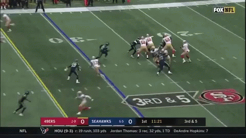 Football Player Being Tackled
