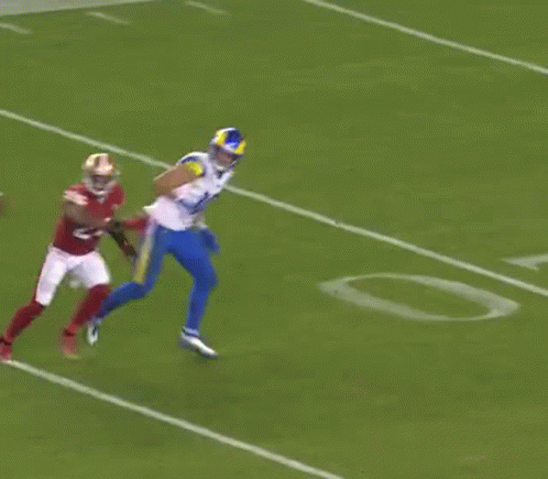 Football Player Being Tackled