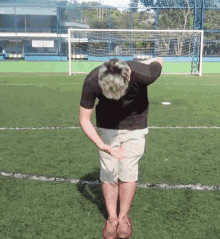 Football Player Bow Down GIF