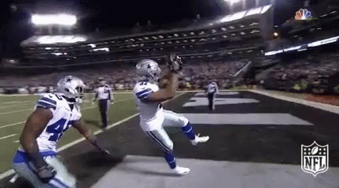 Football Player Catching Ball Teammate Watching GIF