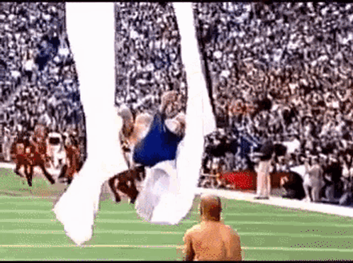 Football Player Flying Through Air