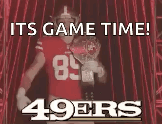 Football Player Holding Championship Trophy