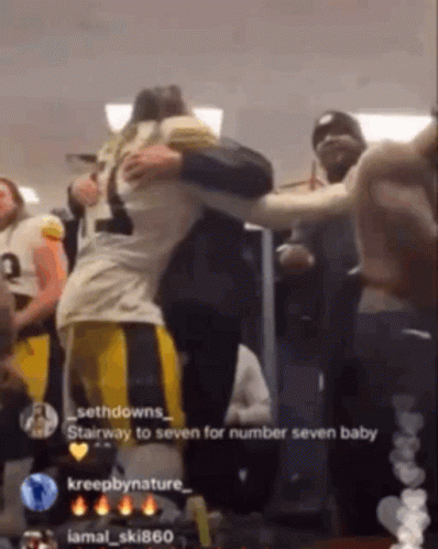 Football Player Hugging Another Player Saying Stairway to Seven