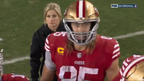 Football Player in 49ers Jersey on Field