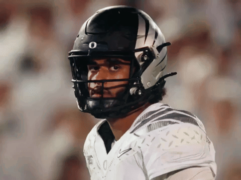 Football Player In Black And White Helmet With Letter O GIF