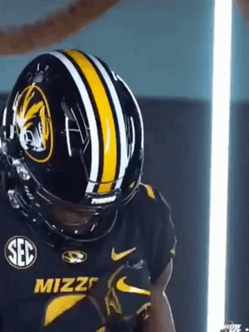 Football Player in Black and Yellow Helmet and Jersey