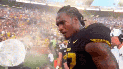 Football Player in Black and Yellow Jersey Number 23