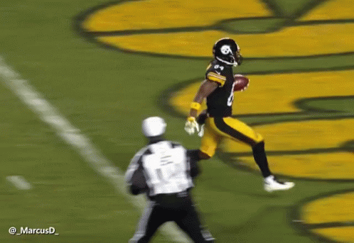 Football Player in Black and Yellow Uniform Number 12