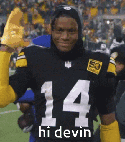 Football Player In Black Jersey Number 14 Giving High Five GIF
