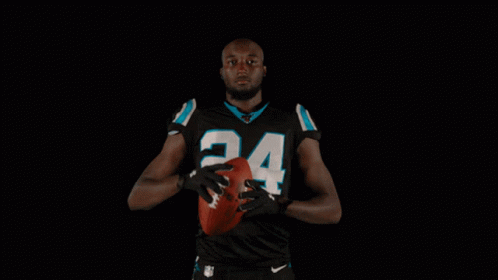 Football Player in Black Uniform Number 24