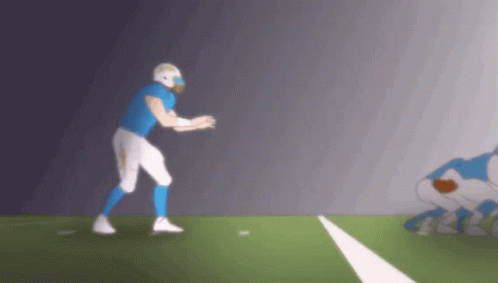 Football Player In Blue And White Uniform About To Throw Ball GIF