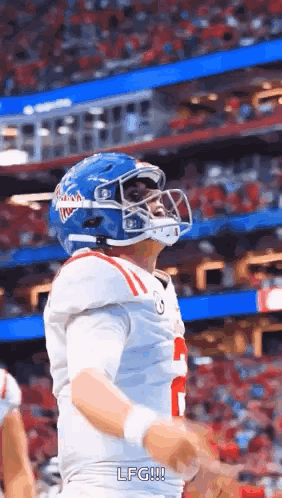 Football Player in Blue Helmet and White Jersey