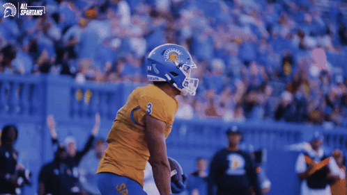 Football Player in Blue Helmet Number 6
