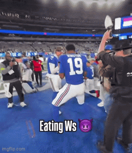 Football Player in Blue Jersey Number 19