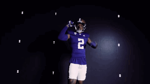 Football Player in Blue Jersey Number 20