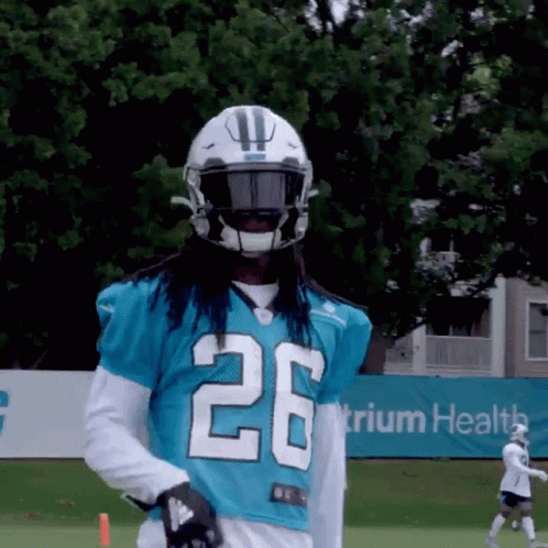 Football Player in Blue Jersey Number 26