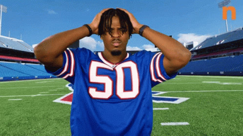 Football Player in Blue Jersey Number 50